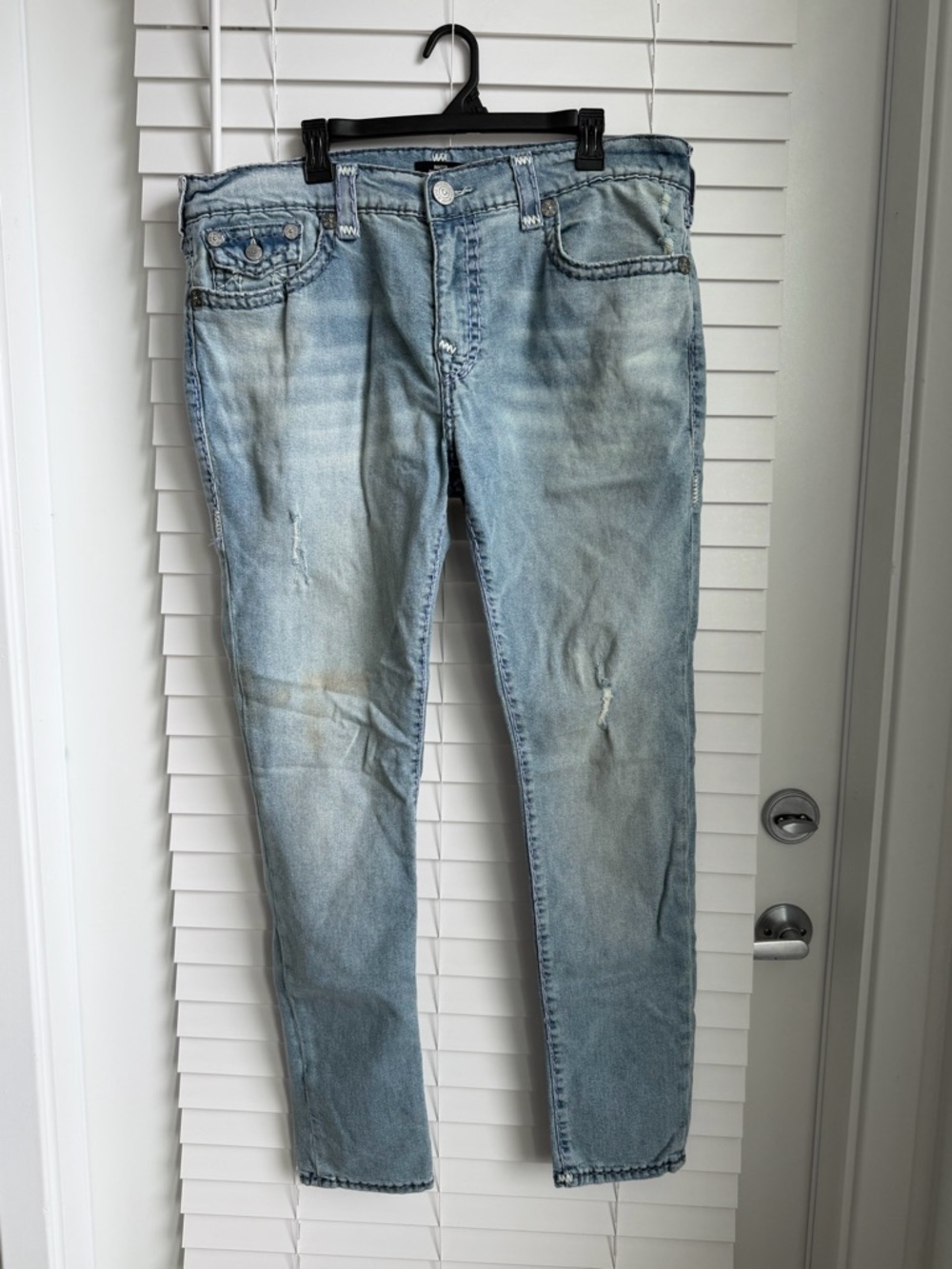 Light Blue Relaxed Skinny Men's True Religion Jeans with Subtle Distressing